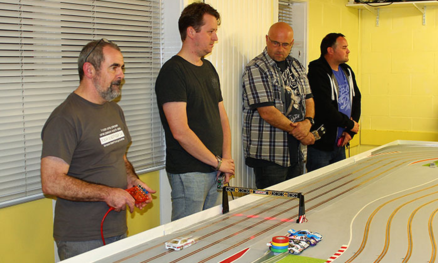 Club racing is a different experience from racing against the family, as many clubs compete with similar vehicles. The track shown here uses a wooden routed track.