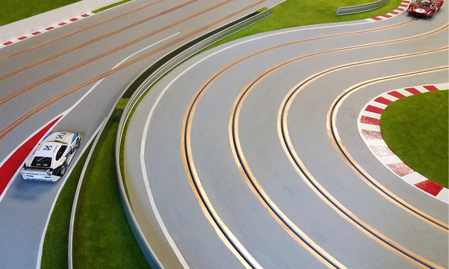 A close-up of a routed track. This track uses copper tape to provide power to the cars.
